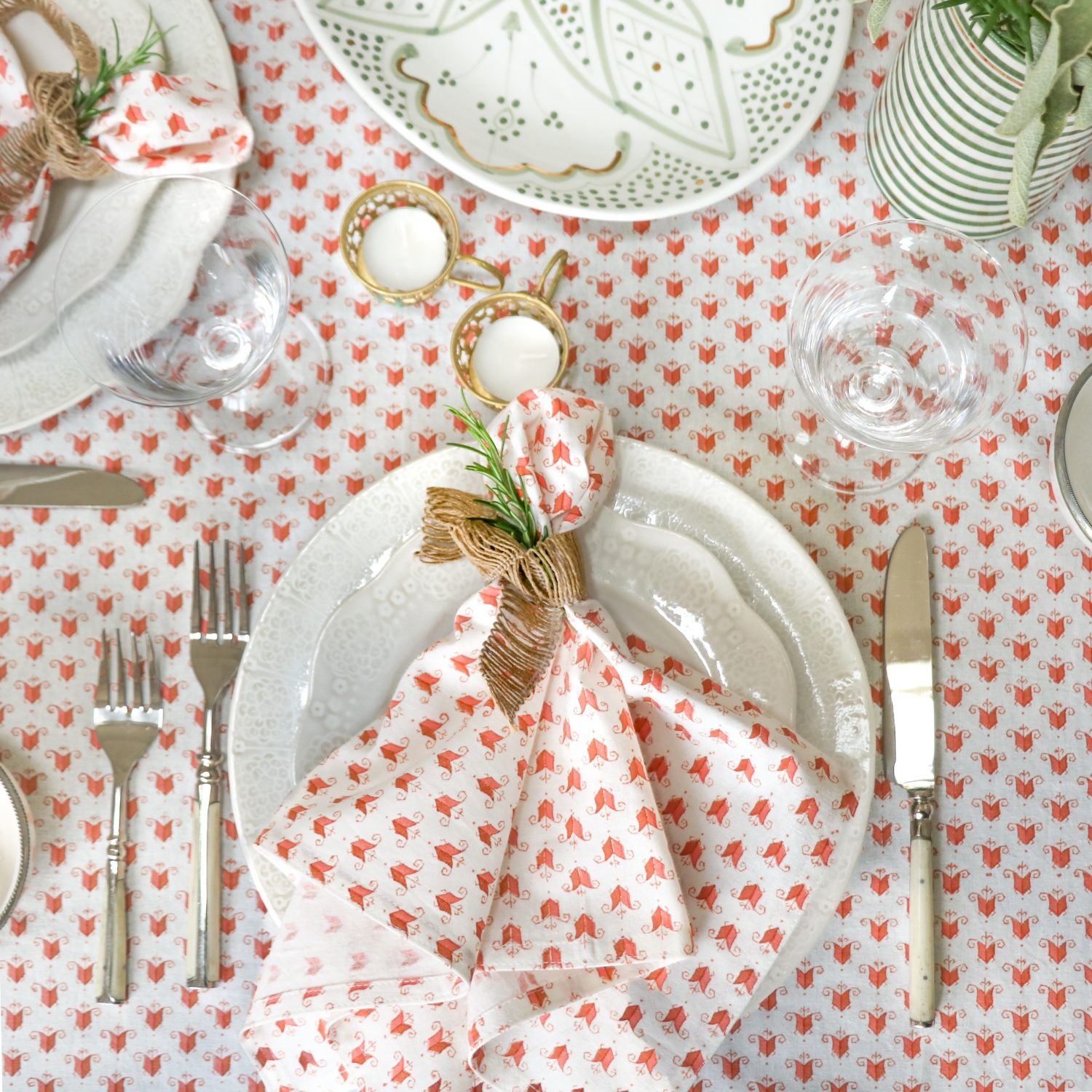 The Livia Tablecloth in Coral and Livia Napkins in Coral shenouk, luxury table linen, table linen, tablecloths, block print tablecloths, indian block print, English block print, online shopping block print, online block print, pink tablecloths, coral tablecloths, orange tablecloths, terracotta tablecloths, striped tablecloths, striped napkins
